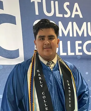 TCC EDGE Graduate Josue Del Rio Salas poses in his cap and gown.