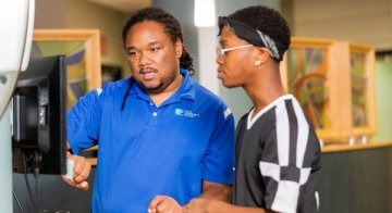 TCC Academic Advisor helps a student enroll.