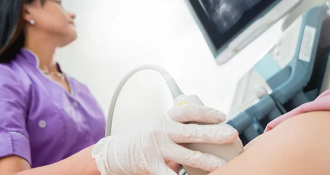 A TCC Diagnostic Medical Sonography Student performs an ultrasound on a patient.