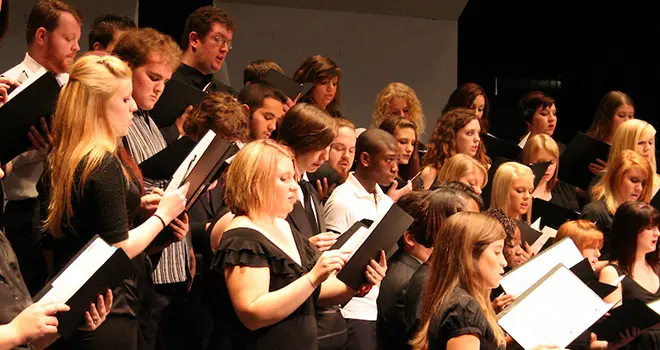 TCC concert choir students performing in concert.