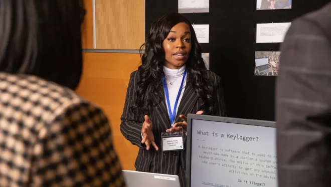 Cyber Skills Center graduate JaQuitta Bailey presents her final project.