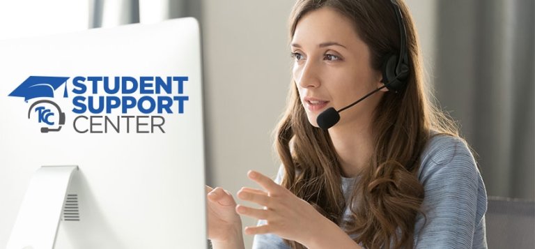 TCC Student Support Center. Young woman sits in front of a computer wearing a microphone offering assistance to a student over the phone.