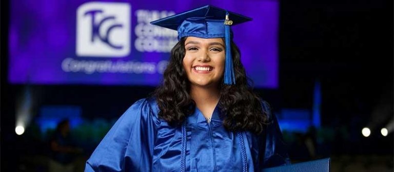 TCC graduate at commencement in their cap and gown