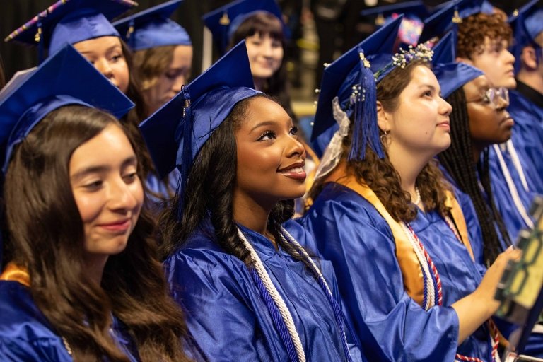 Graduates pose for a photo