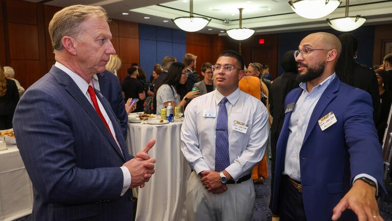 U.S. Rep. Kevin Hern speaks with Adrian Carrillo and Jonathan Ford.